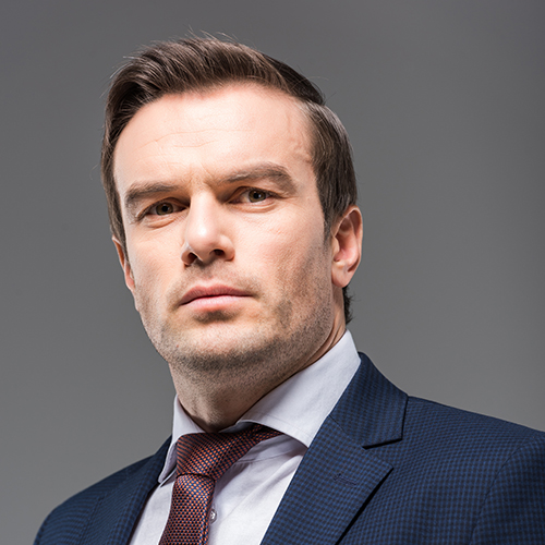 portrait of serious businessman in formal wear, isolated on grey